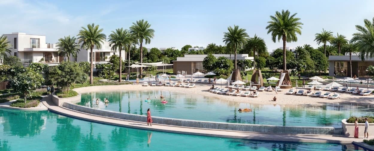 Luxury Emaar villa community in Dubai at dusk with lagoons and palm trees